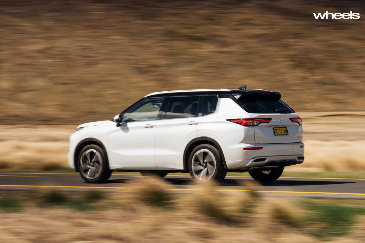 2022_Mitsubishi_Outlander_Exceed_Tourer_White_Diamond_dynamic_rear_acceleration_Australia